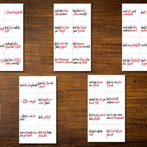 May include: A set of 18 printable cards with black text and red accents. The cards feature various phrases related to celebrating a 60th birthday. The cards are designed to be printed and cut out for use as party decorations or favors.
