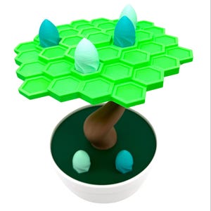 May include: A whimsical, 3D-printed tree sculpture. The tree features a bright green, hexagonal canopy with teal and light green bud-like structures. The brown trunk rises from a dark green base within a white bowl. Additional teal buds are at the base.