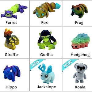 May include: Nine 3D printed animal figurines, each with a unique color and design. The animals include a ferret, fox, frog, giraffe, gorilla, hedgehog, hippo, jackalope, and koala.