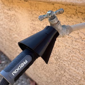 May include: A black hose nozzle adapter is attached to a water faucet. The adapter has a flared design and connects to a gray and black hose with the brand name "ReiXi" printed on it. The faucet is old and has a green patina.