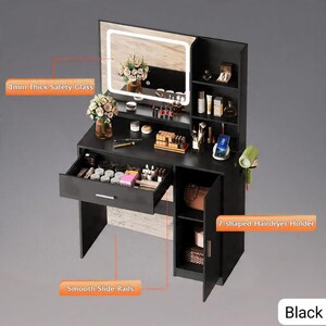May include: Black vanity table with a lighted mirror, drawers, and storage shelves. The vanity features a 4mm thick safety glass mirror and a 7-shaped hairdryer holder. The drawers have smooth slide rails. The vanity is filled with makeup and accessories.