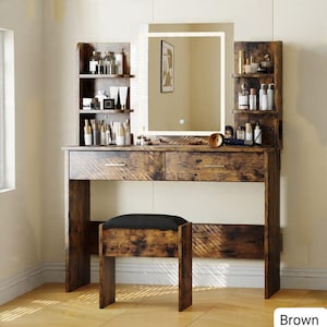 May include: Brown wooden vanity set with a lighted mirror, two drawers, and side shelves. Includes a matching stool with a black cushioned seat. The vanity is designed for makeup and beauty routines.