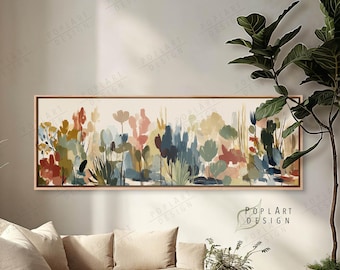 May include: A long, rectangular canvas art piece featuring an abstract floral design in a variety of colors, including red, blue, and yellow. The artwork is framed in a light brown wooden frame. The text "POPLART DESIGN" is visible in the bottom right corner.