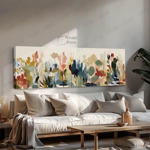 May include: A long rectangular canvas art piece featuring an abstract floral design. The artwork showcases a variety of colorful brushstrokes in shades of red, blue, green, and yellow, creating a vibrant and textured landscape.