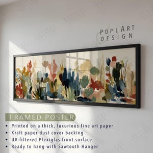 May include: A framed poster featuring an abstract floral design in a rectangular black frame. The artwork showcases a variety of colorful brushstrokes in shades of red, blue, green, and yellow. The poster is ready to hang with a sawtooth hanger.
