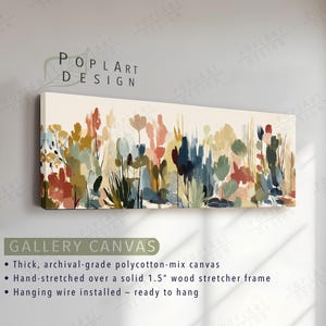 May include: A rectangular gallery canvas print featuring an abstract floral design. The artwork showcases a variety of colorful brushstrokes in shades of red, blue, green, and yellow. The canvas is stretched over a 1.5-inch wood frame and ready to hang.