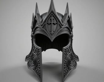 May include: A dark grey, ornate helmet with a medieval design. The helmet features a cross emblem and intricate carvings, including spiral and floral patterns. It has a pointed crown and cheek guards, suggesting a historical or fantasy theme.
