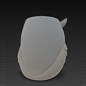 May include: A light gray, owl-shaped wall decoration. The owl has a rounded body, wings, and a small horn-like protrusion. The design is smooth and minimalist, with subtle details. The background is a dark gray, textured surface.