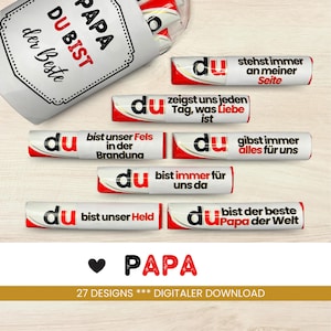 May include: A set of 10 red and white chocolate bar wrappers with the word "du" and various German phrases printed on them. The phrases include "bist unser Fels in der Branduna", "zeigst uns jeden Tag, was Liebe ist", "bist immer für uns da", "gibst immer alles für uns", "stehst immer an meiner Seite", and "bist der beste Papa der Welt".