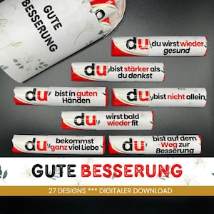 Könnte beinhalten: Eine Auswahl an weiß-roten Schokoriegeln mit deutschem Text, darunter "Gute Besserung". Die Riegel tragen aufmunternde Sätze wie "Du wirst wieder gesund" und "Du bist stärker als du denkst".
