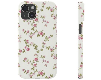 Puede incluir: Una funda de teléfono blanca con un patrón floral de rosas rosas y hojas verdes.