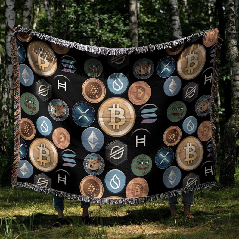May include: A black woven throw blanket with a repeating pattern of various cryptocurrency logos, including Bitcoin, Ethereum, Dogecoin, and Shiba Inu. The logos are in different colors and sizes, and some are surrounded by a black circle.