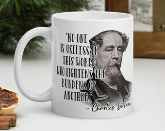 Charles Dickens - MUG -“No one is useless in this world who lightens the burdens of another.” - History Quotes Mug