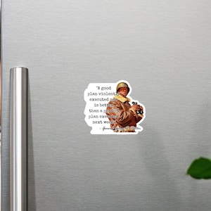 May include: A white sticker with a quote by General George S. Patton. The quote reads, "A good plan violently executed now is better than a perfect plan executed next week." The sticker features a vintage image of a man in a military uniform.