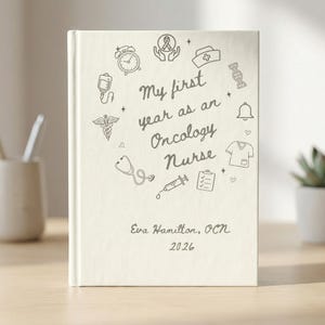 May include: A cream-colored journal with the text "My first year as an Oncology Nurse" and medical-themed illustrations. The name "Eva Hamilton, OCN" and the year "2026" are also printed on the cover.