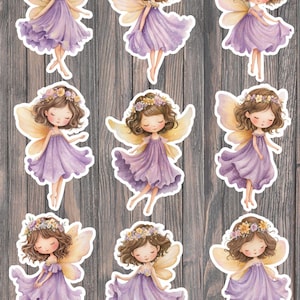 May include: Nine stickers featuring watercolor illustrations of fairies. Each fairy has brown hair, a floral crown, and delicate wings. They wear flowing purple dresses. The stickers are on a wooden background.