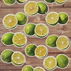 May include: A collection of stickers featuring green limes, some whole and some sliced in half to reveal the juicy interior. The stickers are arranged on a wooden background, creating a fresh and vibrant design.