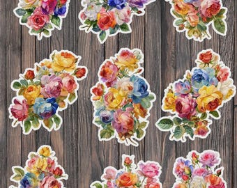 May include: Nine floral stickers featuring watercolor bouquets of roses in various colors, including red, yellow, pink, blue, and orange. Each sticker has a white border and is set against a dark wood grain background. The stickers are ideal for scrapbooking or crafting.