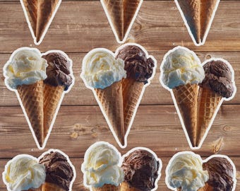May include: Nine ice cream cones, each with two scoops of ice cream. One scoop is vanilla, and the other is chocolate. The cones are a light brown color, and the ice cream is white and brown. The background is a wooden surface.