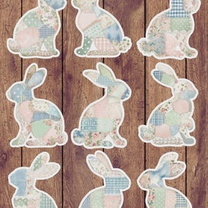 May include: Nine rabbit-shaped cutouts arranged in a grid, each featuring a patchwork design of various pastel-colored fabrics. The patterns include floral prints, blue and white gingham, polka dots, and solid soft pinks, all outlined in a white border.