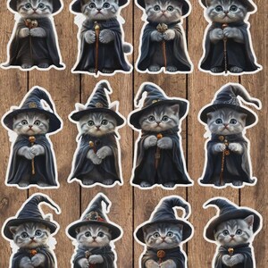 May include: A collection of twelve stickers featuring a gray tabby kitten dressed as a wizard. Each kitten wears a black witch hat and cape, holding a wand. The stickers are arranged on a wooden background.