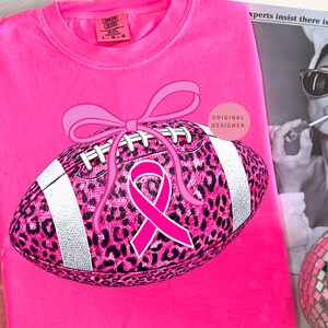 Breast cancer football png, Pink ribbon png, Leopard football png, Pink out sublimation design, October awareness png, Coquette fall png
Pink glitter football with leopard print, pink ribbon & coquette bow October breast cancer awareness shirts and sublimation.
breast cancer png, pink ribbon png, pink out png, tackle cancer png, leopard football png, football png, pink football png, cancer awareness png, pink October png, football mom png, preppy breast cancer, game day png, pink out football