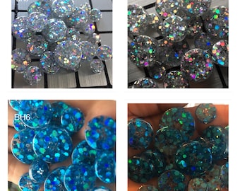 Several colors. Unique buttons made of epoxy resin with holographic glitter insertion.