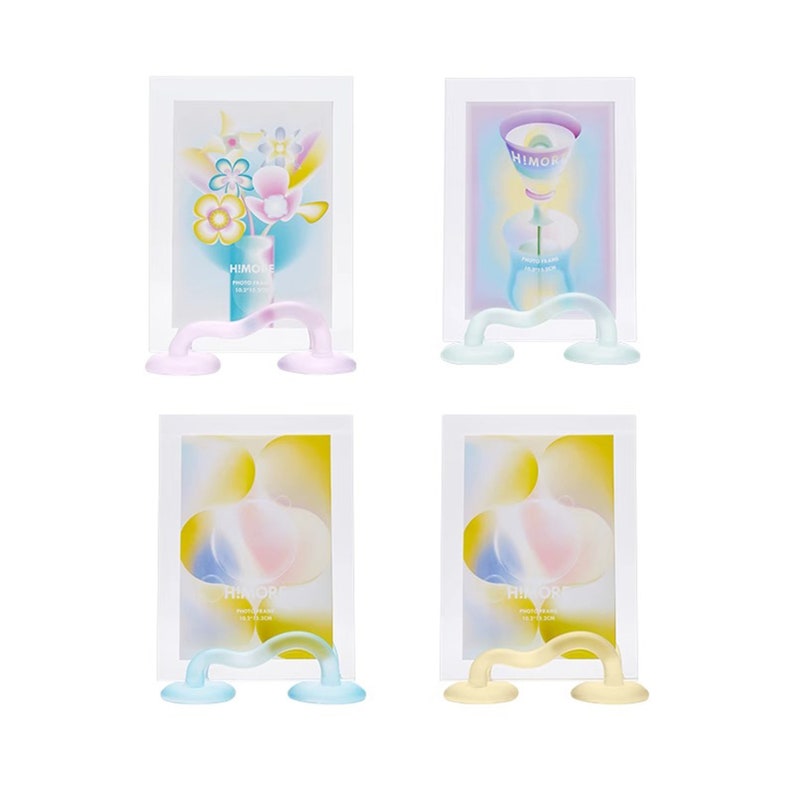 May include: Four white picture frames with colorful abstract designs and the word "HIMORE" printed on each. Each frame is held up by a clear, wavy, glass stand with two round bases.