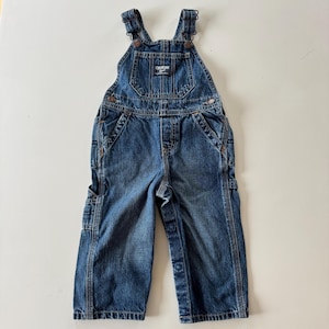 May include: A set of three ceramic mugs with a speckled, matte finish. The mugs are in shades of cream, light gray, and dark gray. Each mug has a simple, minimalist design, perfect for coffee or tea.