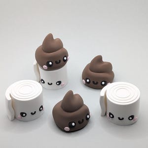 May include: Five small, hand-crafted figurines of poo and toilet roll. Each figurine has a cute cartoon face with black eyes, pink cheeks, and a smiling mouth. The poo figurines are brown and the toilet roll figurines are white.