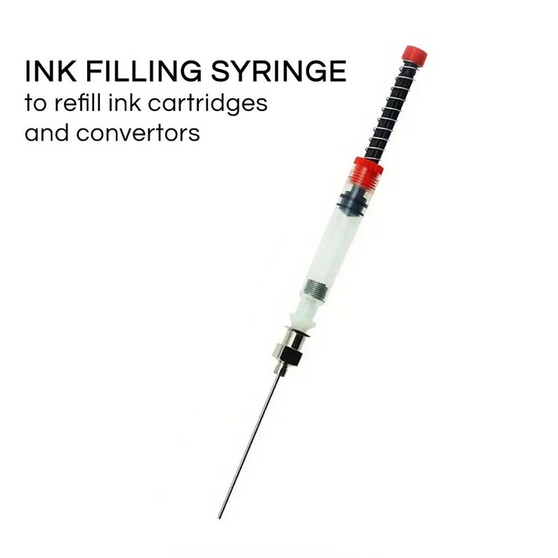 May include: An ink filling syringe with the text "INK FILLING SYRINGE to refill ink cartridges and converters." The syringe has a clear barrel, a red cap, and a long, thin needle. The syringe is designed for refilling ink cartridges.