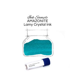 May include: A bottle of Amazonite Lamy Crystal Ink, filled with a vibrant teal ink. A small ink sample tube with the text "Lamy Crystal Ink Amazonite" is next to the bottle. The image is set against a white background.
