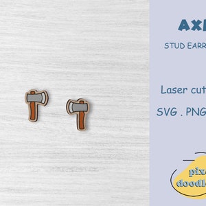 May include: A pair of wooden stud earrings featuring a cartoon axe design. The axe is gray with a brown handle. The earrings are laser cut and come in SVG, PNG, and EPS file formats.