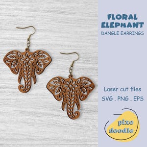 May include: Two laser-cut wooden dangle earrings in the shape of elephants. The earrings are brown with intricate floral patterns and have gold-colored hooks. The text "FLORAL ELEPHANT DANGLE EARRINGS" is visible.
