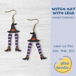 May include: A pair of dangle earrings featuring a witch hat with legs. The hat is black with a red band and the legs are striped purple and black. The earrings are made of laser cut wood and are perfect for Halloween.