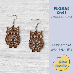 May include: Two brown, laser-cut owl dangle earrings with floral designs. The earrings have gold-colored hooks. The text "FLORAL OWL DANGLE EARRINGS" is in the image, along with "Laser cut files SVG. PNG. EPS" and the logo "pixo doodle."