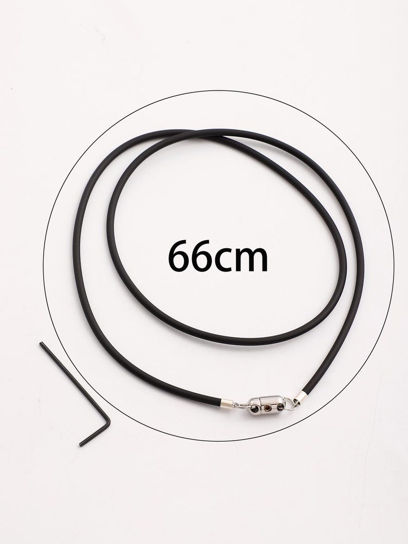 May include: Black rubber necklace with a silver magnetic clasp. The necklace is 66 inches long.
