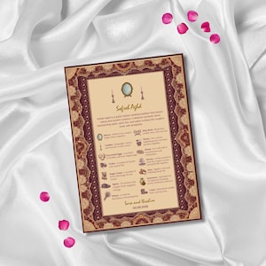May include: A decorative wedding invitation with a maroon and gold ornate border. The invitation features the text "Safreh Aghd" and includes a list of symbolic items. Pink rose petals are scattered around the invitation on a white satin background.
