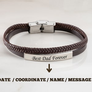 May include: Brown leather bracelet with a silver clasp and a silver plate engraved with the text "Best Dad Forever".