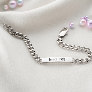 May include: Silver chain bracelet with a personalized nameplate that reads "Jessica 1995".