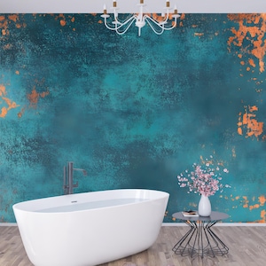 May include: A white bathtub sits in a bathroom with a teal and copper wall, a small black side table with a vase of pink flowers, and a white door with vertical blinds.