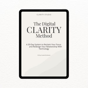 May include: A digital tablet shows the title "The Digital CLARITY Method" in a bold, serif font. The screen also includes the text "A 30-Day System to Reclaim Your Focus and Redesign Your Relationship With Technology." The tablet has a black border and is set against a white background.