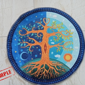 May include: A round, blue and green tapestry with a stylized tree of life design. The tree has orange branches and a brown trunk. The background is a blue night sky with stars and a crescent moon on one side and a blue day sky with clouds and a yellow sun on the other side.