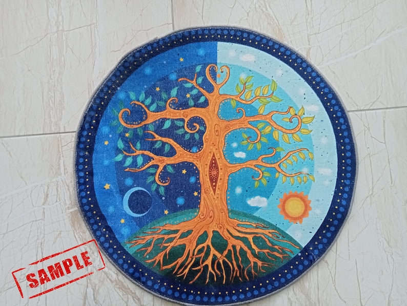 May include: A round, blue and green tapestry with a stylized tree of life design. The tree has orange branches and a brown trunk. The background is a blue night sky with stars and a crescent moon on one side and a blue day sky with clouds and a yellow sun on the other side.