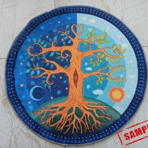 May include: A round tapestry featuring a stylized tree of life with orange branches, green leaves, and blue and white roots. The tree is surrounded by a blue and white background with stars, clouds, a crescent moon, and a sun.