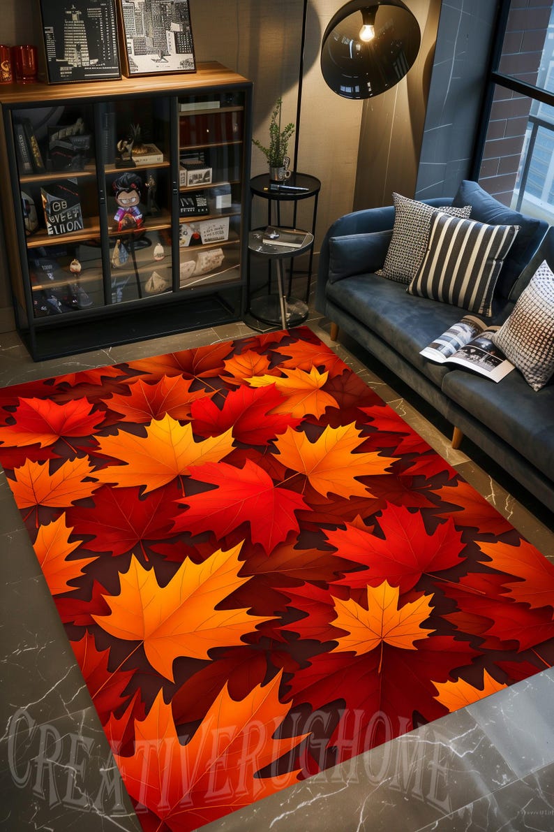 May include: A rectangular rug with a design of autumn leaves. The rug displays a pattern of red, orange, and yellow maple leaves on a dark brown background. The rug is suitable for indoor use and adds a seasonal touch.