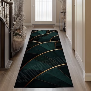 May include: A long, rectangular rug with a dark teal and gold art deco design. The rug features a repeating pattern of fan-shaped elements with gold trim, creating a luxurious and stylish look. The rug is placed in a hallway.