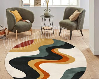 May include: A circular rug with a retro design. It features flowing, wavy patterns in white, black, orange, yellow, and teal. The rug is on a wooden floor, with two armchairs and a small table in the background.