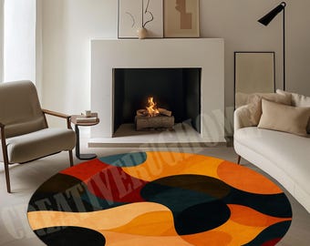 May include: A circular rug with an abstract design in orange, black, red, and teal. The rug features a pattern of overlapping organic shapes. The rug is placed in a living room setting with a fireplace and modern furniture.