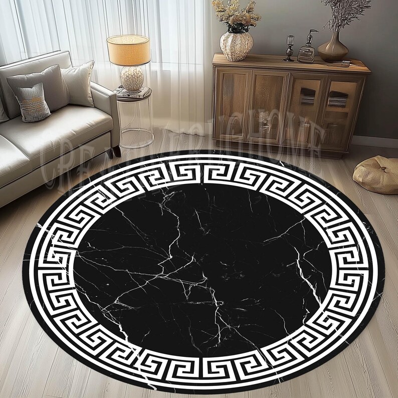 May include: Black and white round rug with a Greek key border. The rug has a marble pattern in the center.
